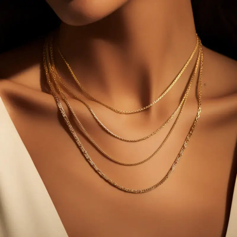 A woman wearing a gold necklace set | Italian Fashions